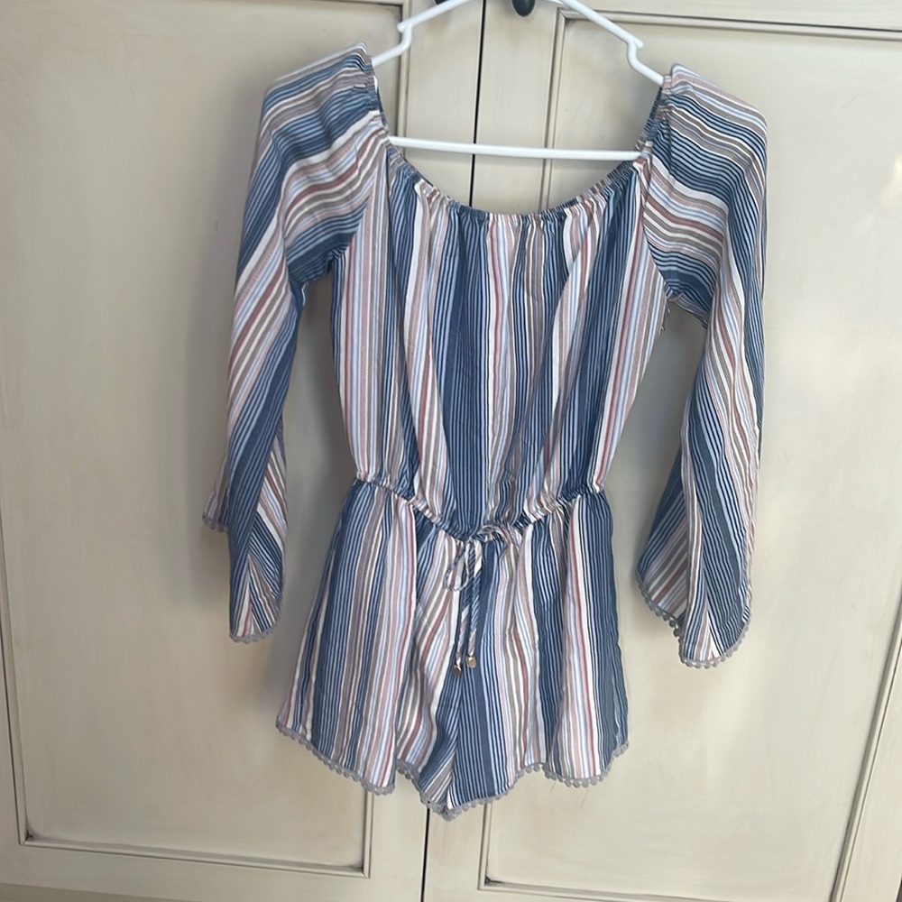 Romper, can be worn on or off the shoulders. Brand new with tags, from Dry Goods